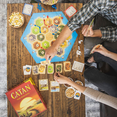Catan Base Game Strategy Board Game - People playing the game
