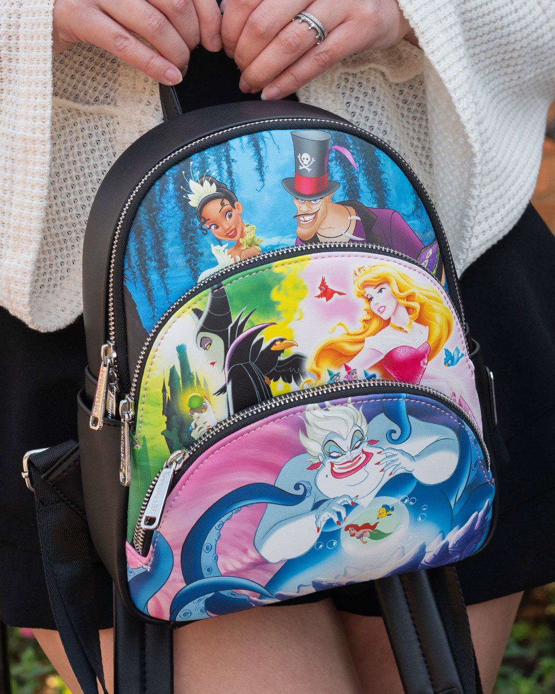 Loungefly Disney Princesses vs Villains Triple Pocket Mini Backpack - 707 Street Exclusive - Girl holding Loungefly backpack