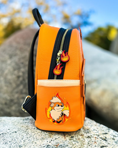 Loungefly Pokemon Growlithe Cosplay Mini Backpack - 707 Street Exclusive - Side view of Pokemon Backpack on Rock
