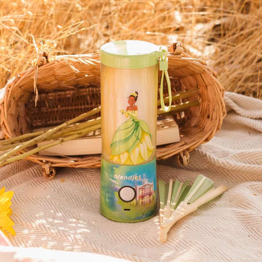 BlendJet 2 Disney Princess and the Frog Tiana Cordless Personal Blender - Blender On Picnic Blanket in Field Setting
