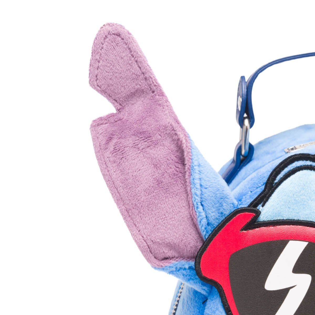 Close-up of Stitch's purple inner ear on the mini backpack.