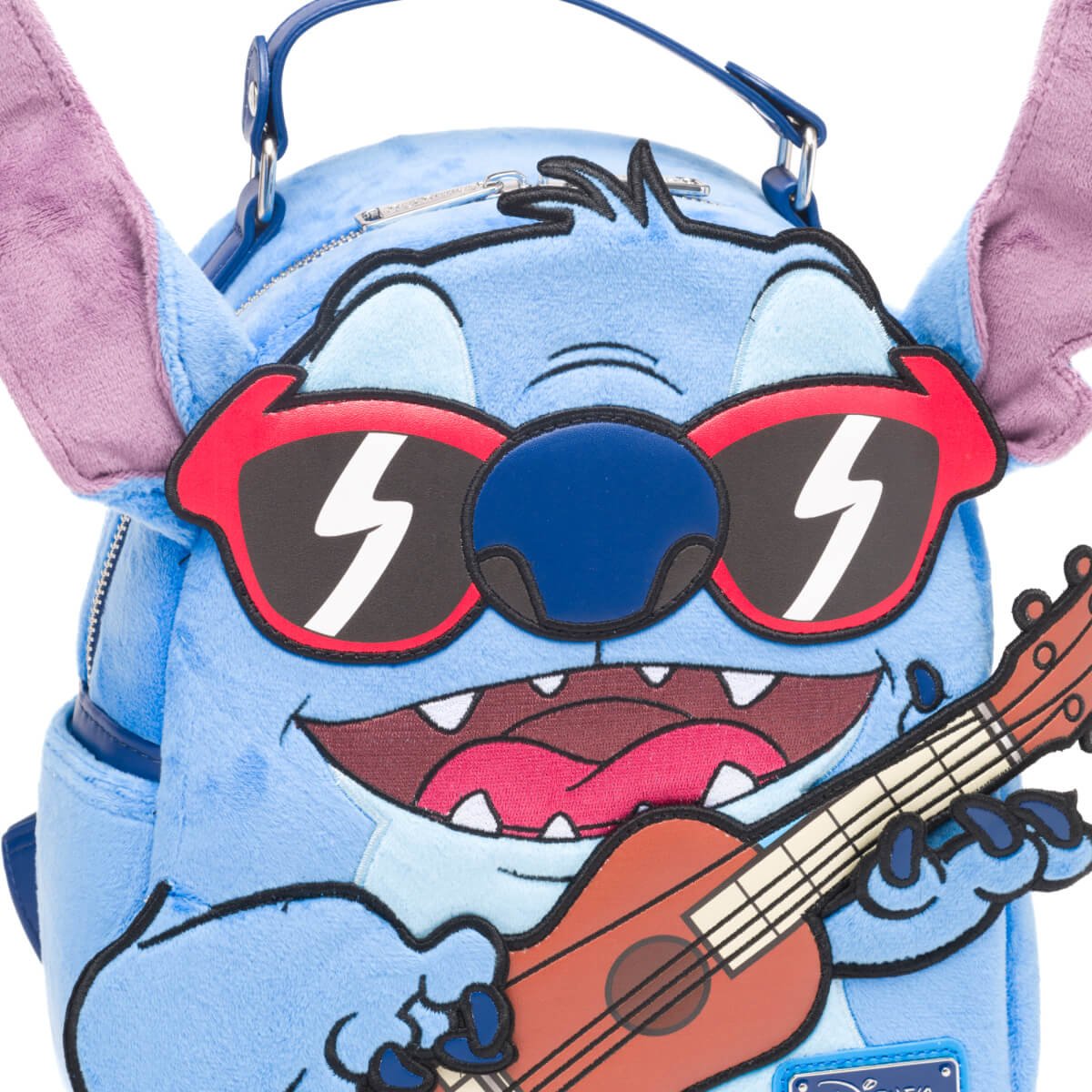 Detailed view of Stitch's face with red sunglasses and a wide grin, holding a ukulele.