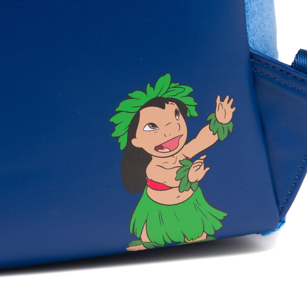 A small illustration of Lilo dancing in a green hula skirt, red top, and leaf accessories, adding a charming touch to the design.