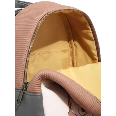 Inside view of a mini backpack with a tan interior lining and a small pocket.