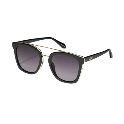 Quay Australia Sweet Dreams sunglasses featuring a square black frame with smoke fade gradient lenses and a metal brow bar, side view