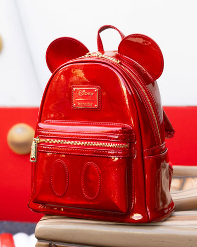 Loungefly Disney Mickey Mouse Holographic Series Mini Backpack: Ruby - 707 Street Exclusive - Red Holographic Loungefly Backpack Side View in Front of Red and White Wall