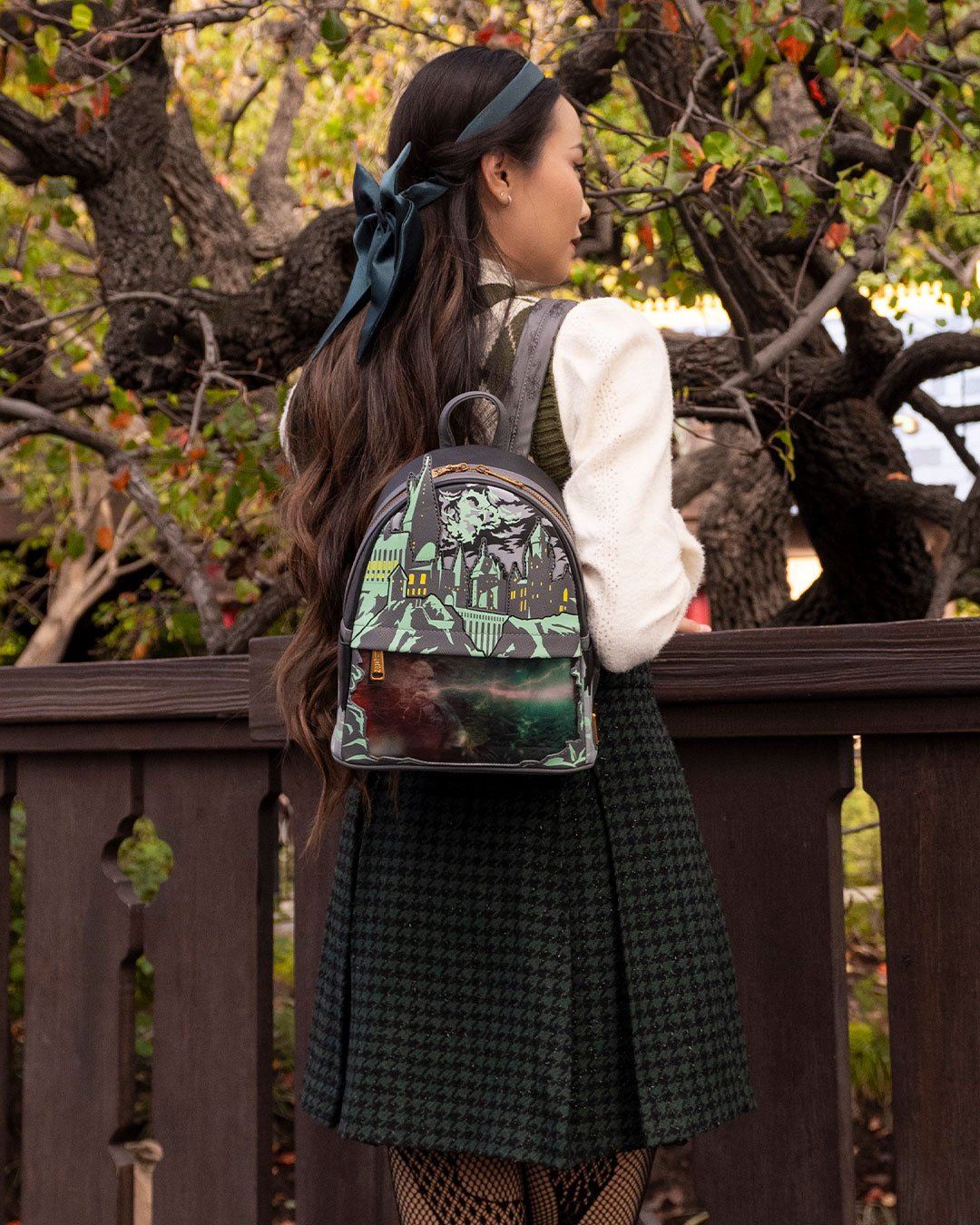 Loungefly Harry Potter Glow in the Dark Battle of Hogwarts Lenticular Mini Backpack - 707 Street Exclusive - Girl in Slytherin Attire Wearing Loungefly Backpack