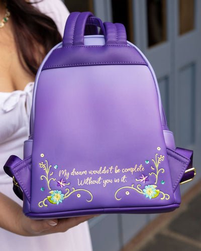 671803454217 - 707 Street Exclusive - Loungefly Disney Princess Dreams Series Tiana Mini Backpack - Girl Holding Backpack at Disneyland Showing the Back Side