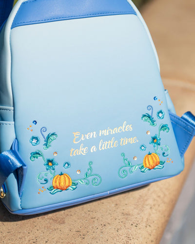 Loungefly Disney Princess Dreams Series Cinderella Mini Backpack - 707 Street Exclusive - Cinderella Loungefly Backpack in Front of Disneyland Castle Showing Back of Bag