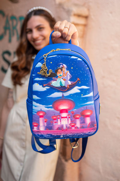 707 Street Exclusive - Loungefly Disney Glow in the Dark Aladdin and Jasmine Magic Carpet Ride Mini Backpack - IRL Front