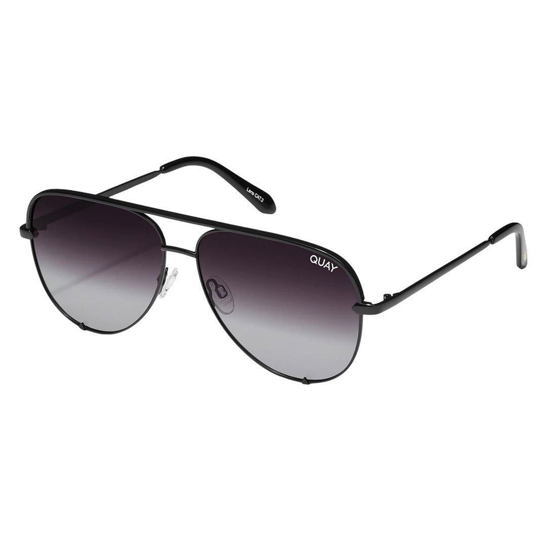 Quay Australia Unisex High Key Mini Classic Aviator Sunglasses featuring a black frame and black fade polarized lenses, showcased from a side angle to highlight the sleek design and adjustable nose pads.